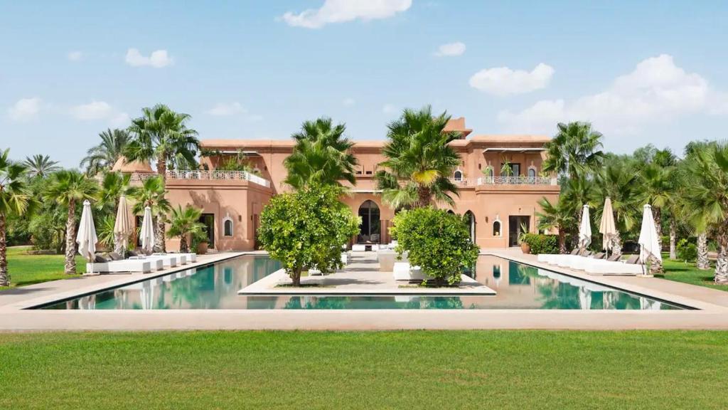 an exterior view of a resort with a swimming pool at Dreamcation Villa in Marrakesh
