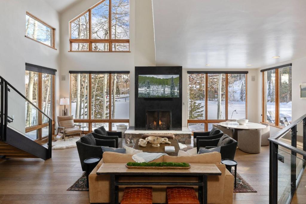 a living room with a couch and a fireplace at Benchmark Dr 101 in Telluride