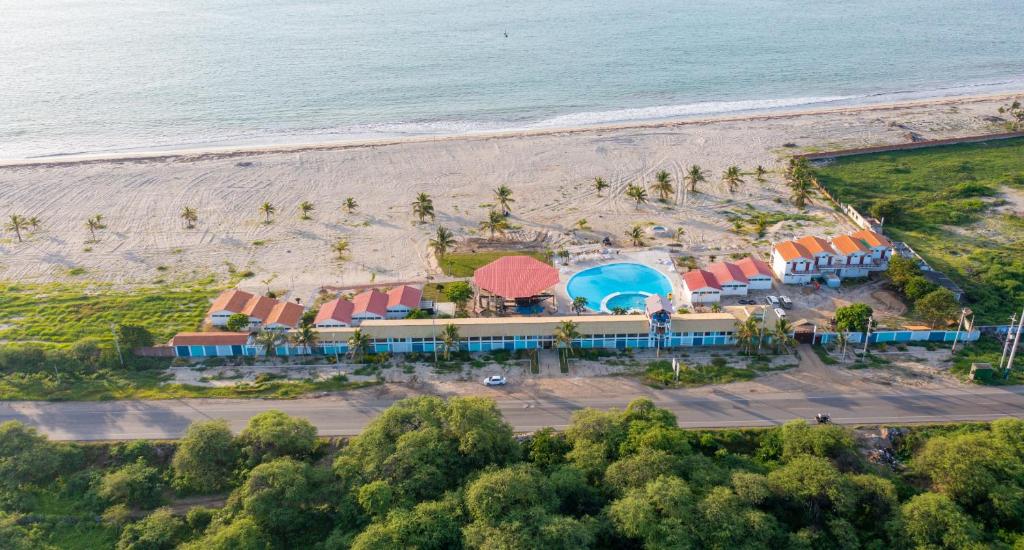 an aerial view of a resort on the beach at Amotape Hotel in Zorritos