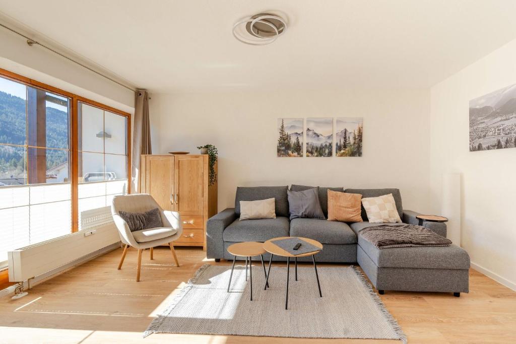 a living room with a couch and a table at Bergluft in Bad Hindelang