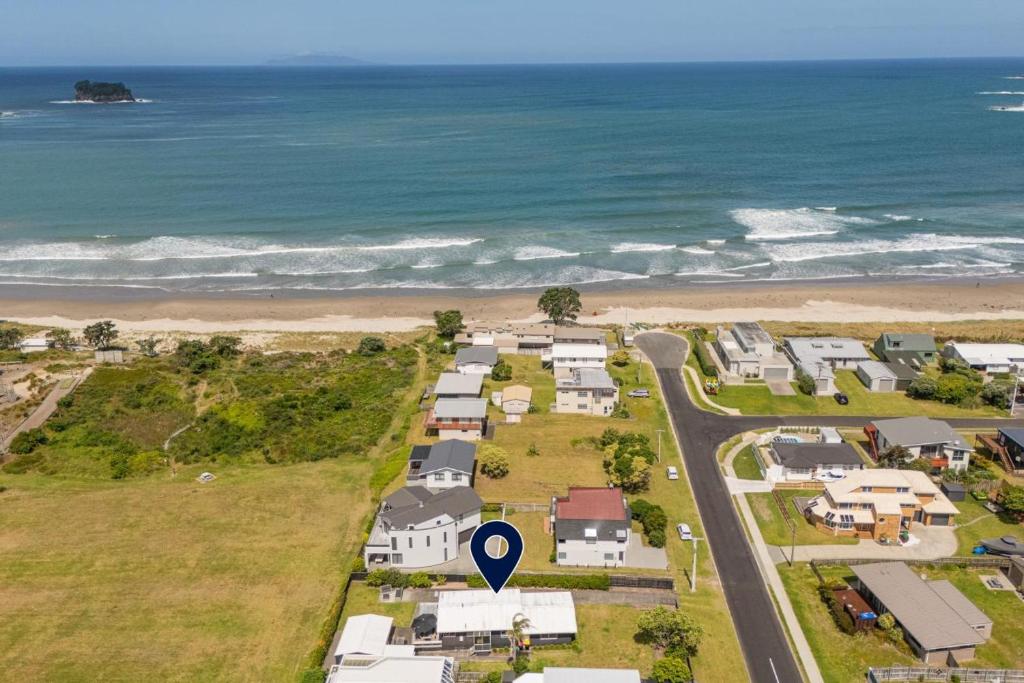 an aerial view of a house on the beach at Beachside on Hinemoa in Whangamata