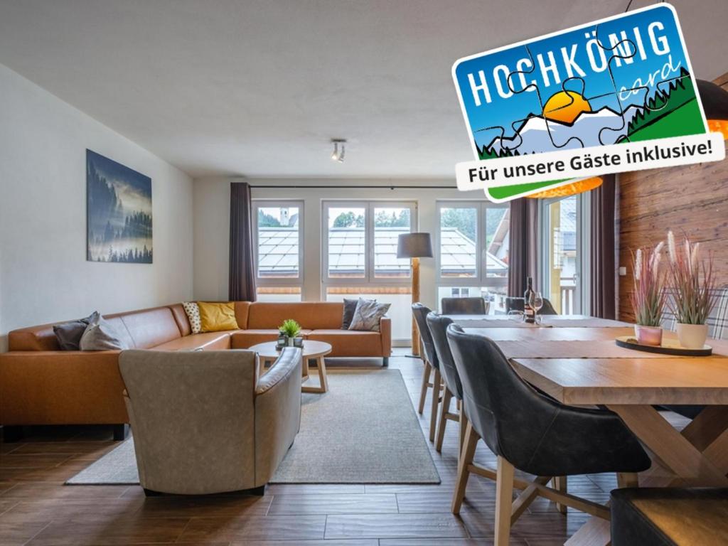 a living room with a couch and a table at Emma Top 1 XL in Dienten am Hochkönig