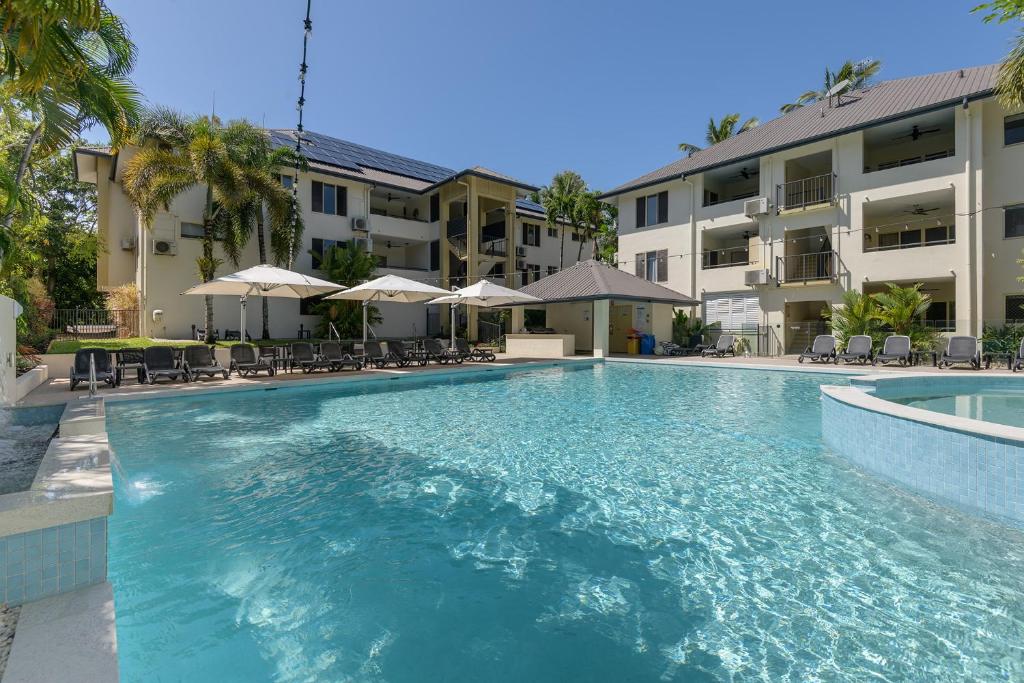 a large swimming pool in front of a building at Central Plaza Port Douglas in Port Douglas