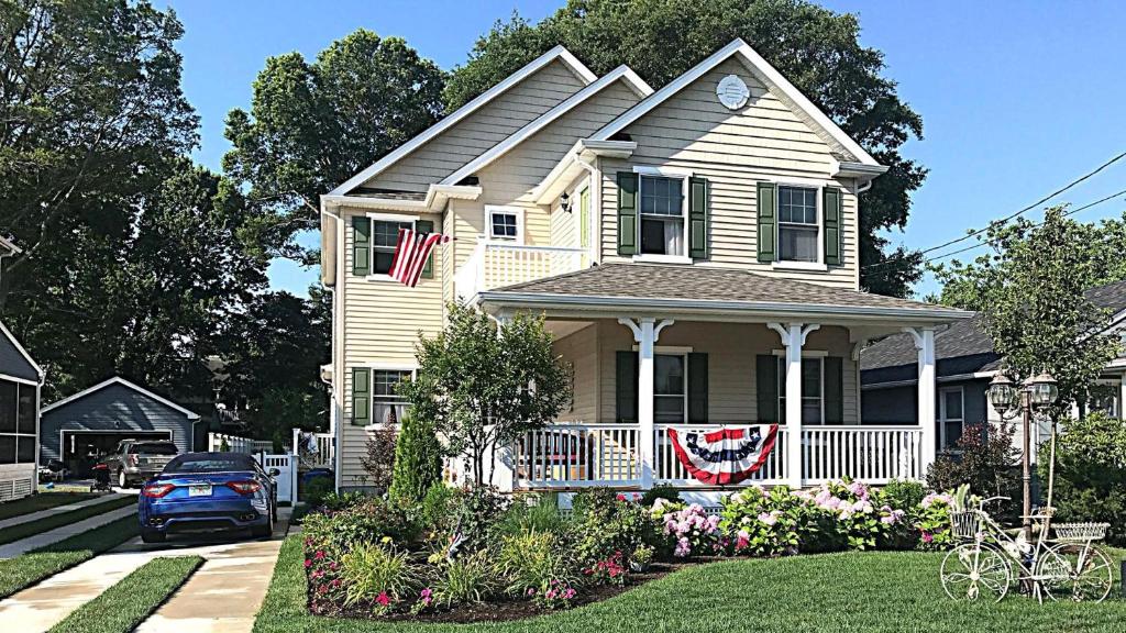 a house with a flag on the front porch at West Cape Oasis in West Cape May