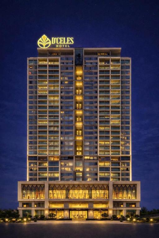 a building with a sign on top of it at D'Celes Hotel in Làng Tiên Cát