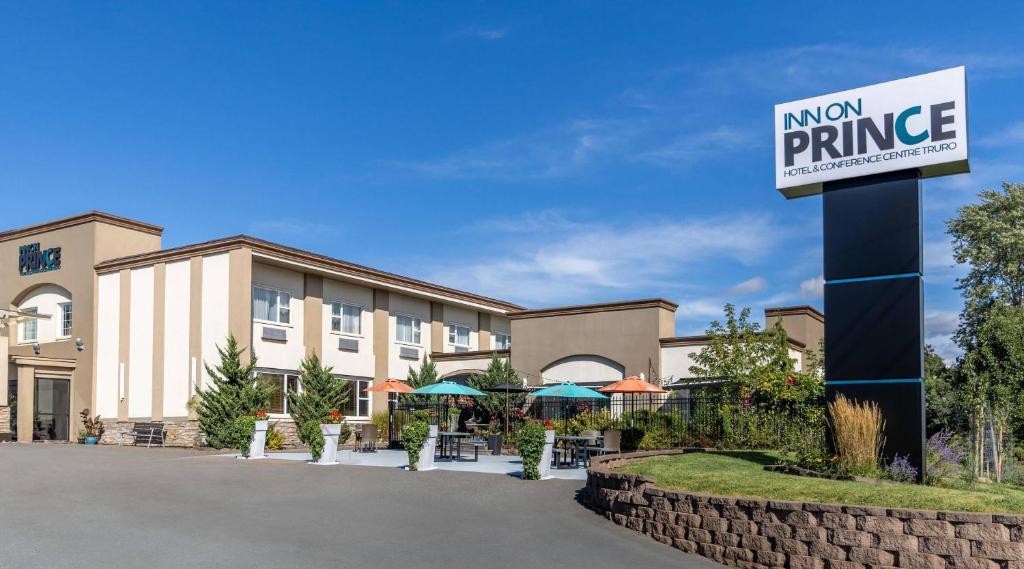 a hotel with a sign in front of a building at Inn on Prince Hotel & Conference Centre, an Ascend Collection Hotel in Truro