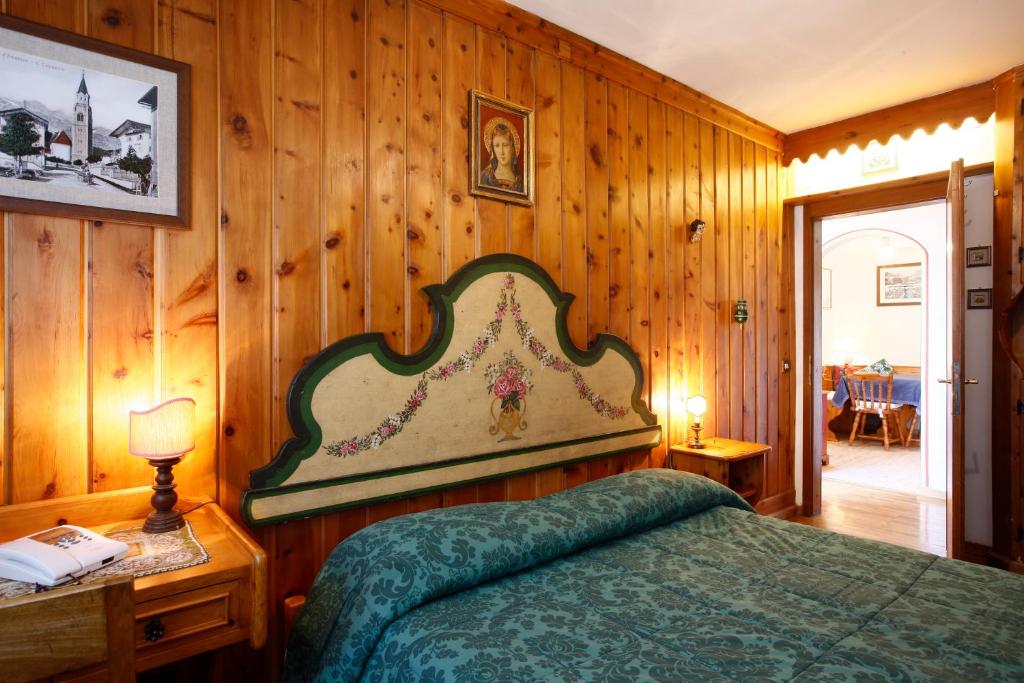 Postel nebo postele na pokoji v ubytování Hotel Corona