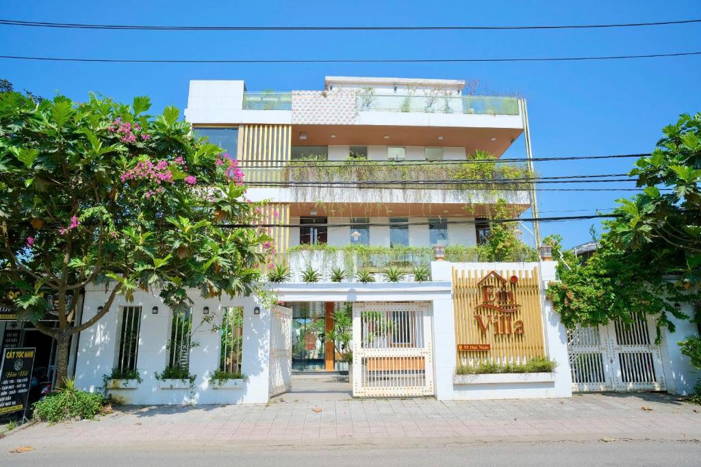 a white building with trees in front of it at Êm Villa 8 Bedrooms with Swimming Pool in Hue
