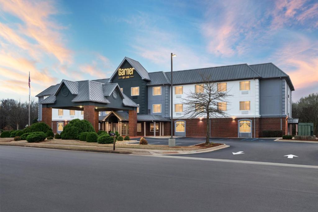 a rendering of a hotel on the corner of a street at Garner Hotel Madison - Huntsville Airport by IHG in Madison