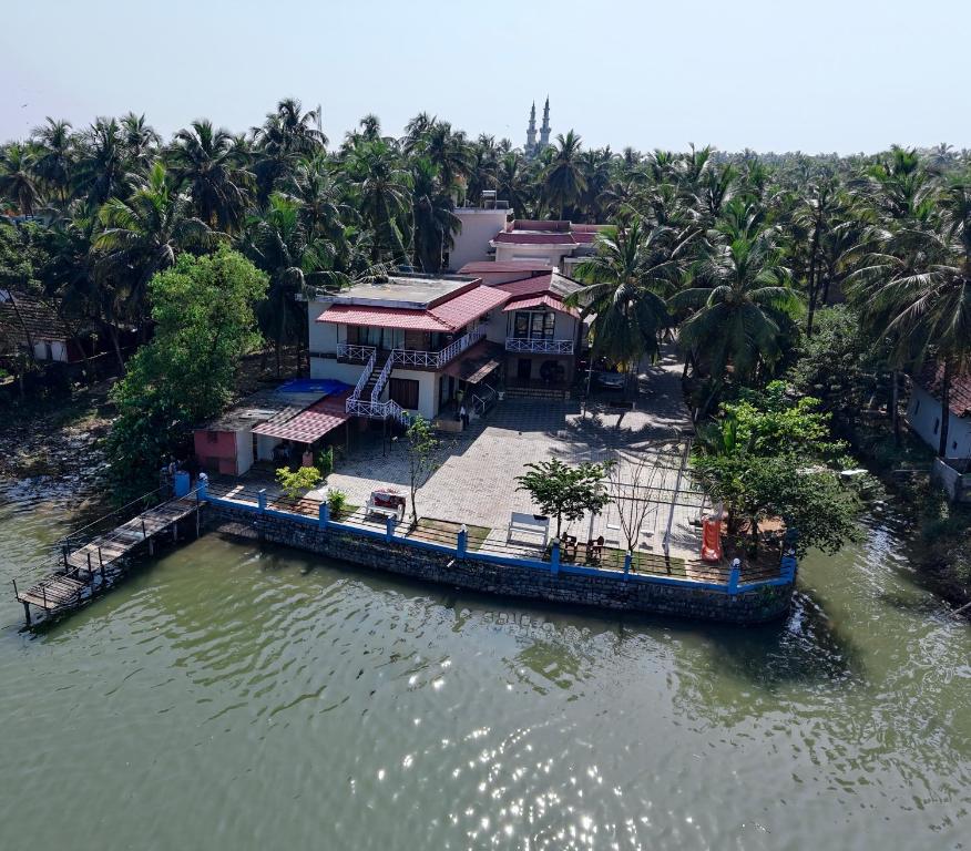an aerial view of a house on the water at Suites by the Glaswater in Kalyānpur
