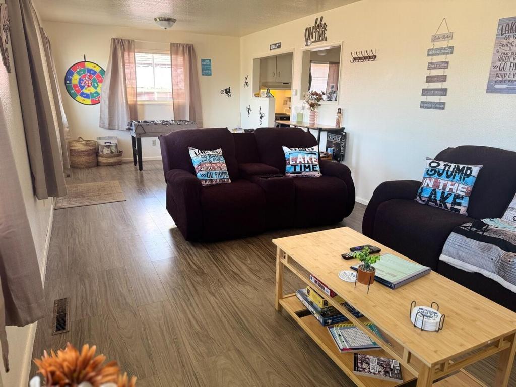 a living room with a couch and a coffee table at Lakeside Dune Getaway in Lakeside