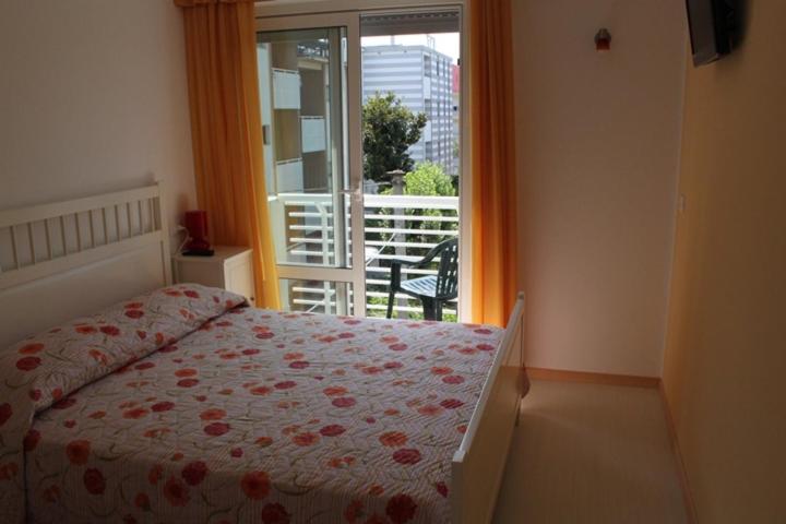 Postel nebo postele na pokoji v ubytování Hotel Capri