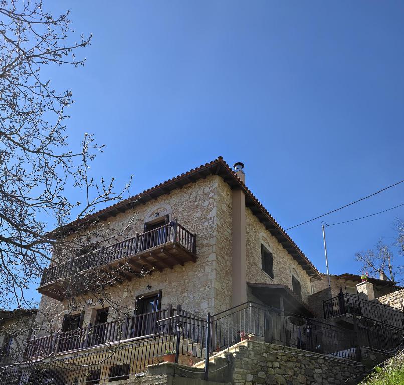 a building with balconies on the side of it at MELATO HOUSES in Valtessiniko