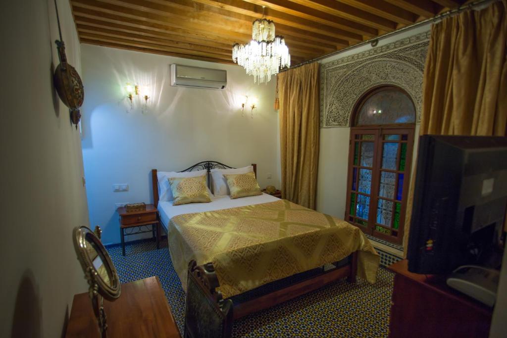 Postel nebo postele na pokoji v ubytování Riad Vega