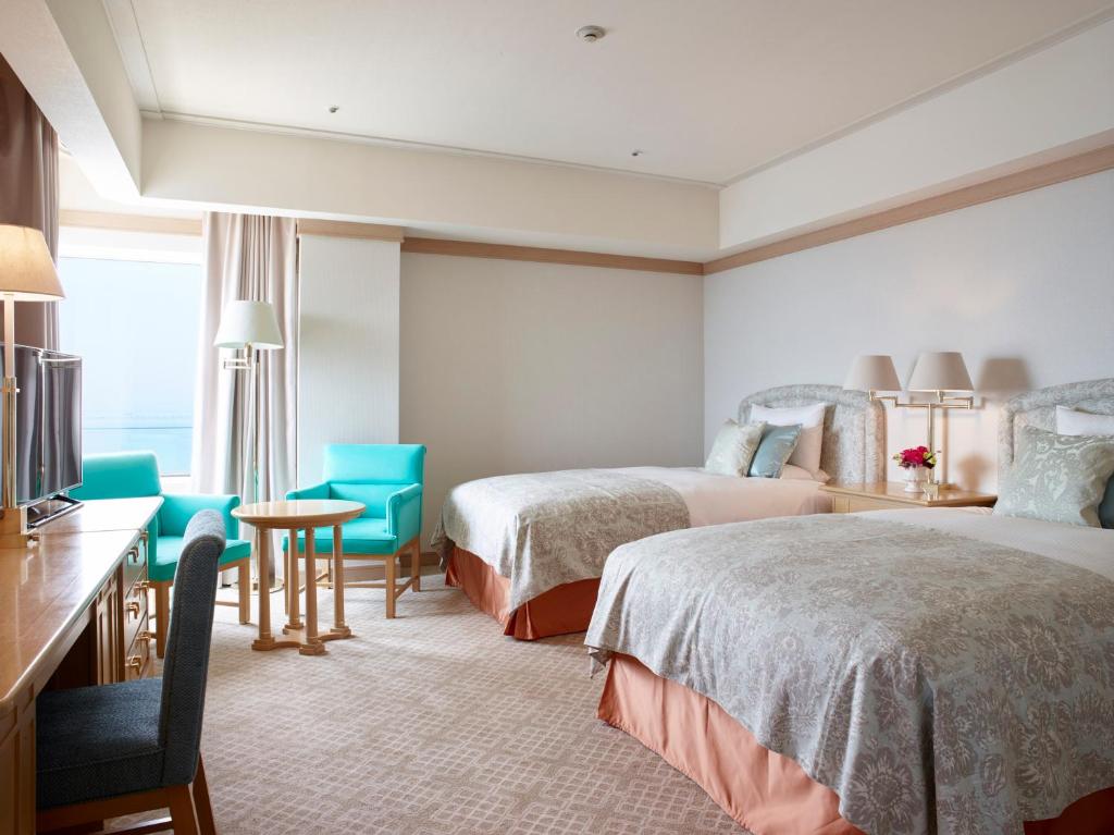 Postel nebo postele na pokoji v ubytování Hotel Okura Kobe