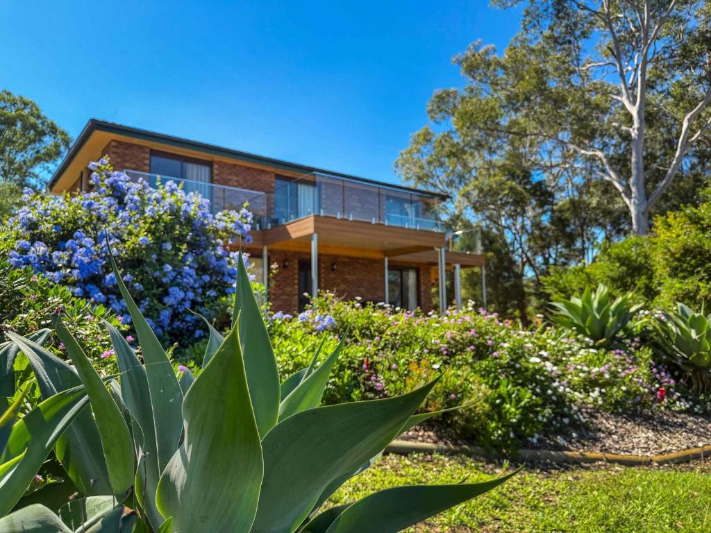 a house with a garden in front of it at Hunter Homestead in Lovedale