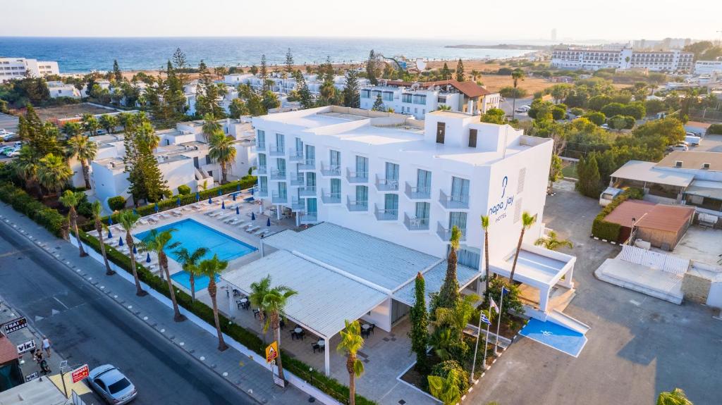 an aerial view of a building and the ocean at Napa Jay Hotel in Ayia Napa