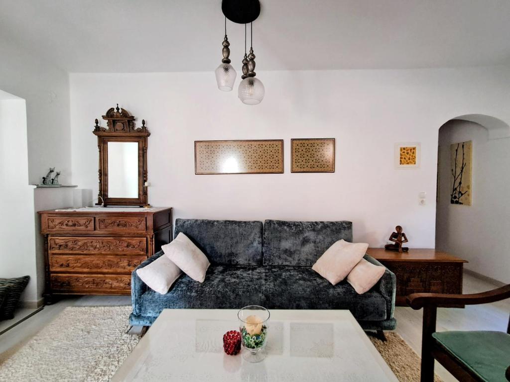a living room with a couch and a table at Parga Center Apartment in Parga