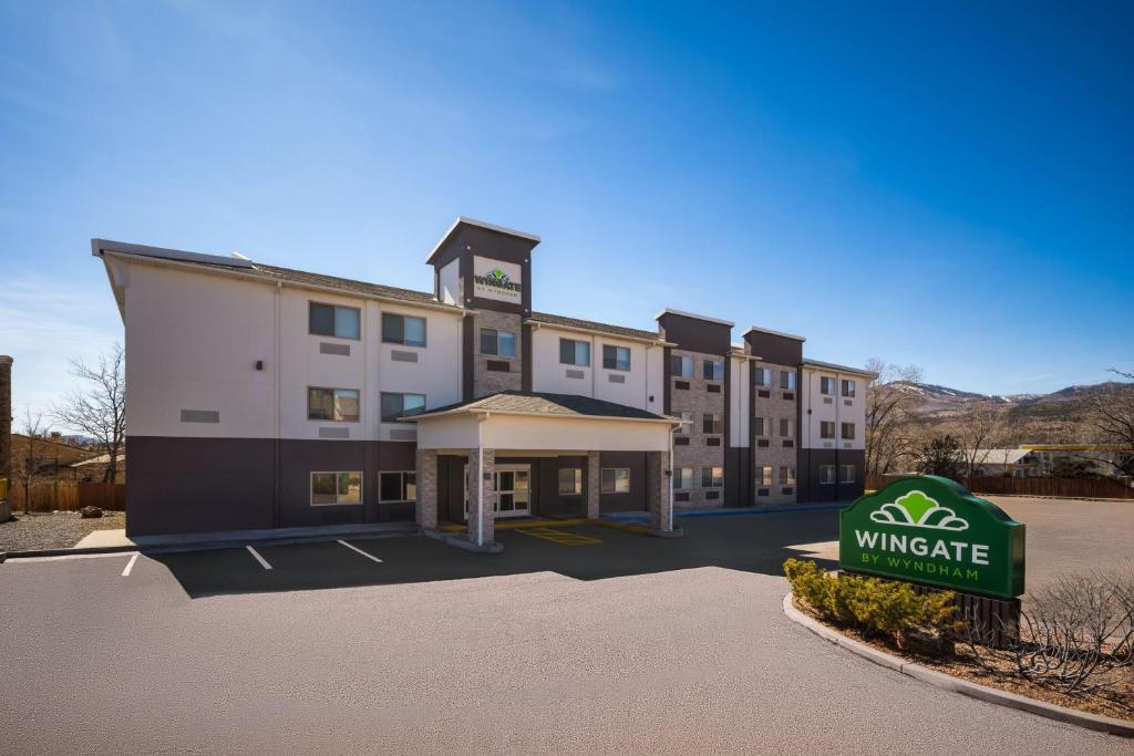 a rendering of a hotel with a sign in front of it at Wingate by Wyndham Los Alamos in Los Alamos