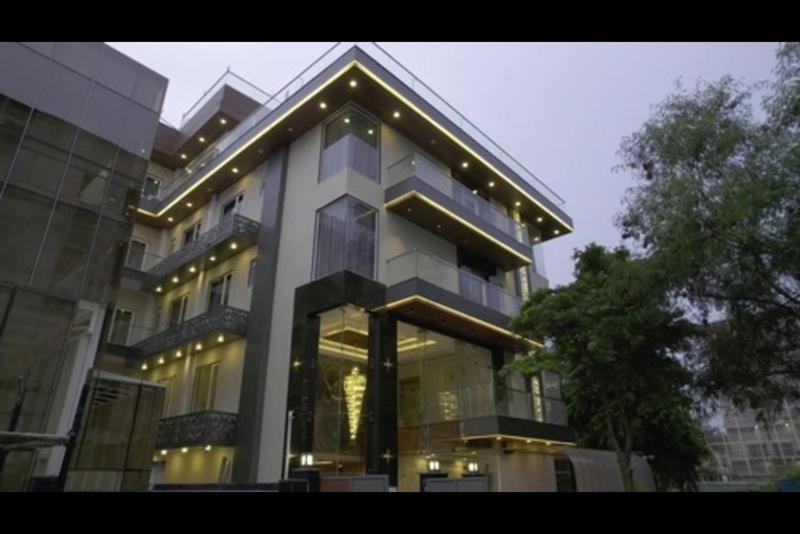 a large building with lights on top of it at The Grand Oasis Hotel & Resort I Near India Expo Mart in Greater Noida