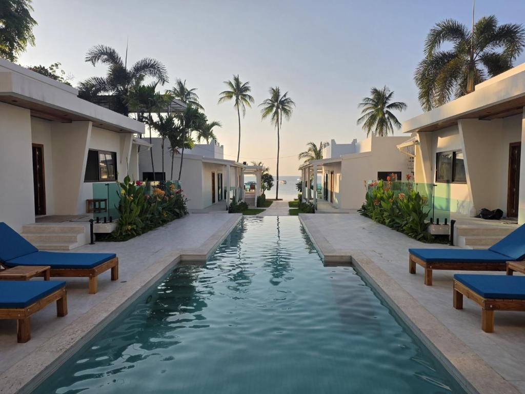a swimming pool in the middle of a resort at Casa By The Sea in Bangrak Beach