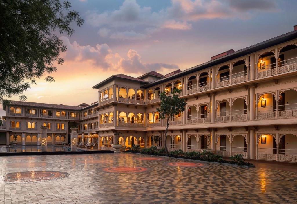 a large building with a courtyard at dusk at Gateway Kandla Gandhidham in Gandhidham