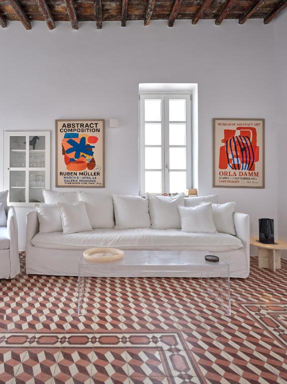 a white living room with a white couch at Chiara Mykonos III in Mikonos