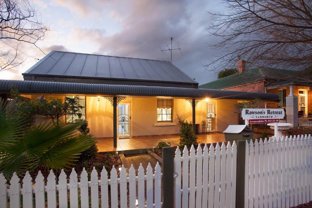 a white picket fence in front of a house at Rawson's Retreat - Five Bedroom Home - Walk CBD - Includes Breakfast in Tamworth