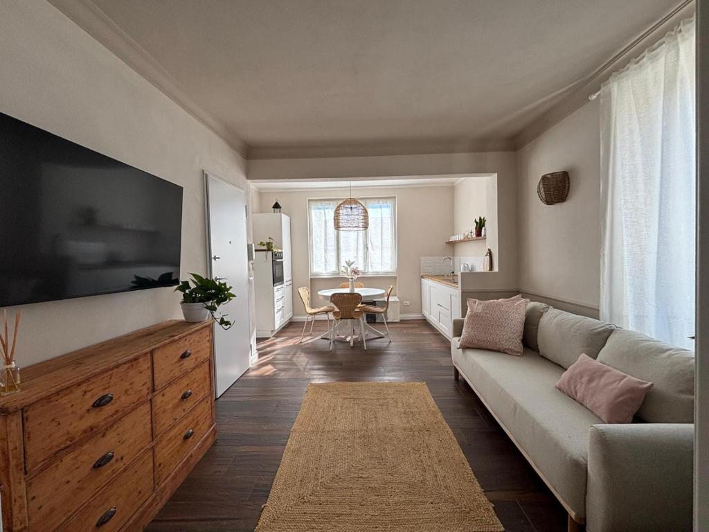 a living room with a couch and a table at HH Moneglia La Caletta in Moneglia