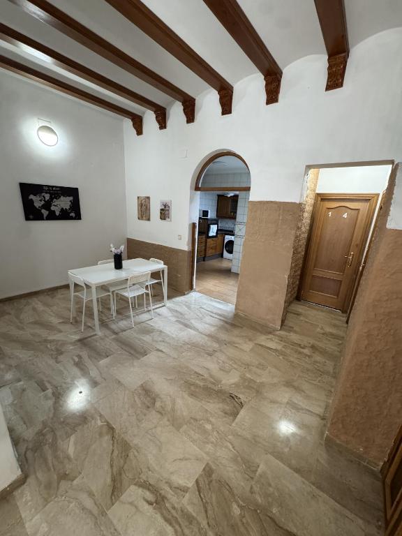 a large room with a table and a hallway at Apartament Mediteranean in Valencia