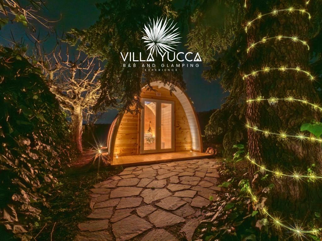 a entrance to a home with christmas lights at Villa Yucca - Luxury Glamping Experience in Torano Nuovo