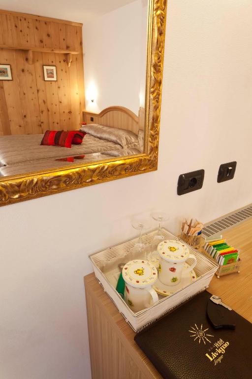 Postel nebo postele na pokoji v ubytování Hotel Livigno