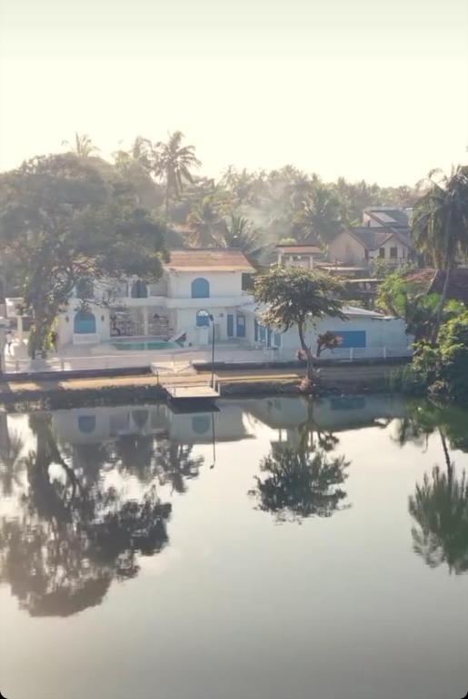 a house on the water with a dock at The Tranquilite' in Anuradhapura