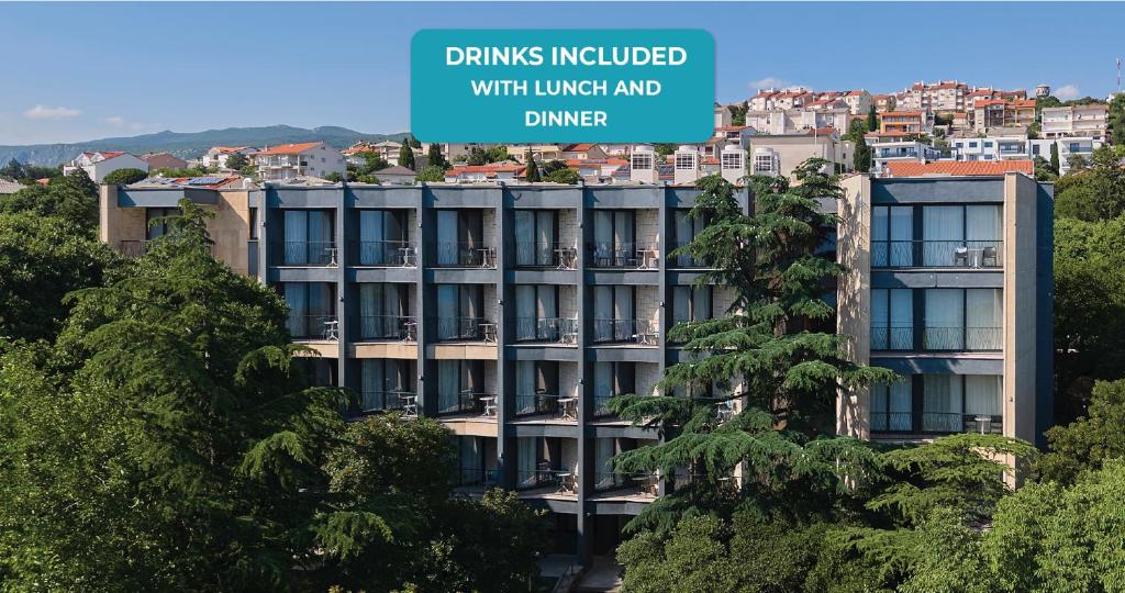 a building with a sign that reads drinks included with lunch and dinner at Aminess Vival Casa Lišanj in Novi Vinodolski