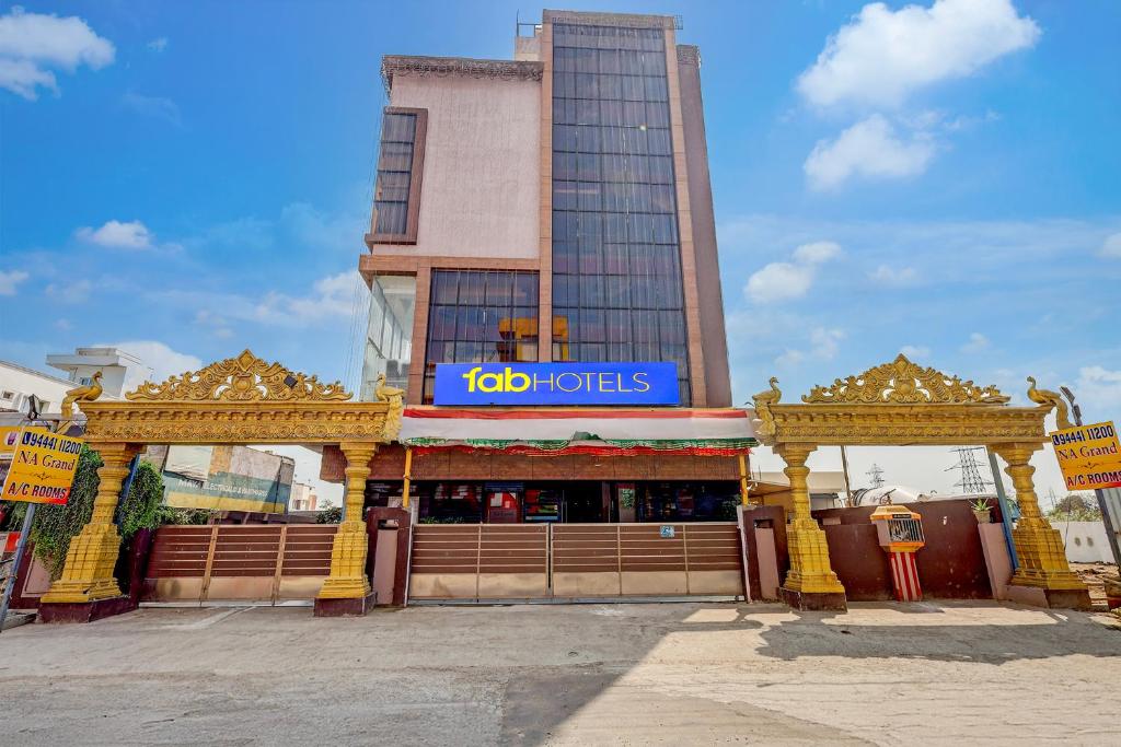 a building with ajob tots sign in front of it at FabHotel NA Grand in Chennai