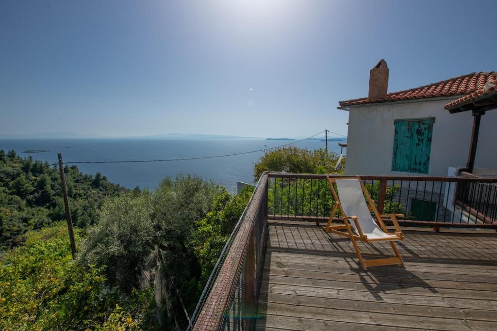 a balcony of a house with a view of the ocean at Aegean Dream in Klíma