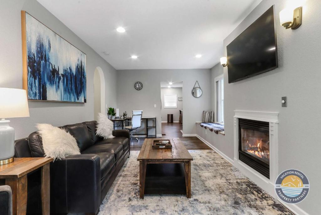a living room with a couch and a fireplace at Charming Pet-Friendly Lake Retreat in Lake Geneva
