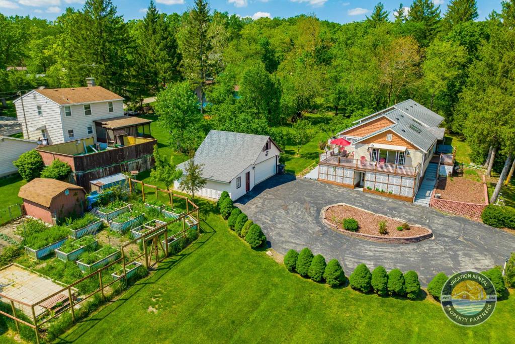 an aerial view of a home with a large backyard at Exclusive Lake Como Escape with Bar and Pool Table in Lake Geneva