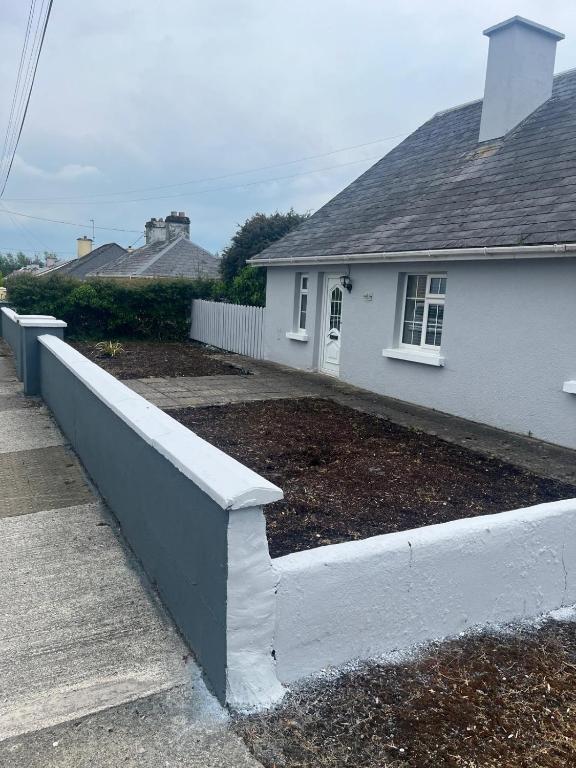 a retaining wall in front of a house at Explore the west in Loughrea