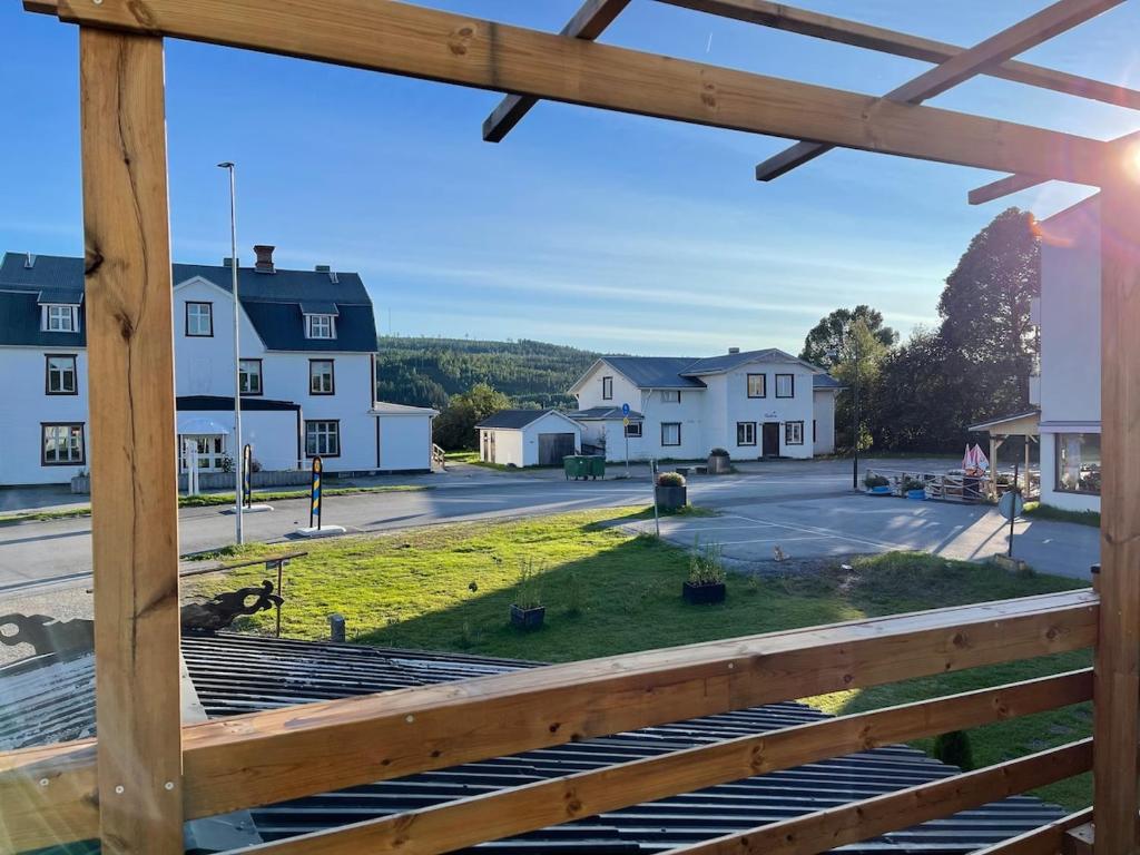 a view from a porch of a street with houses at Gästis in Sollefteå