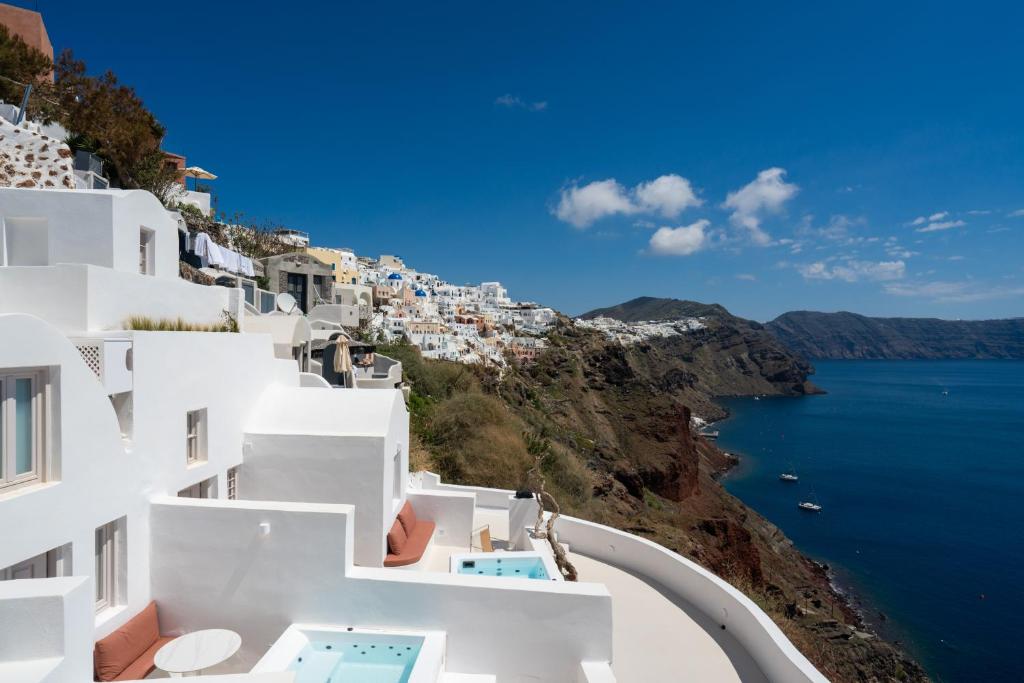 a view of the amalfi coast with white buildings at You and Me Suites Oia in Oia