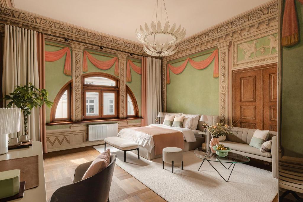 a bedroom with a bed and a chandelier at Residence 9 in Krakow
