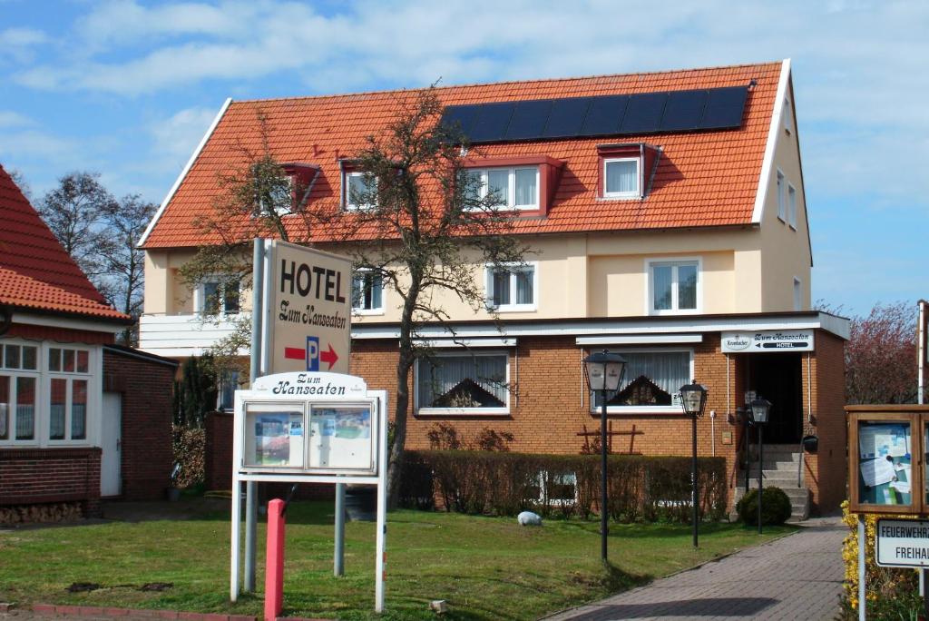 a hotel sign in front of a building at Zum Hanseaten in Borkum