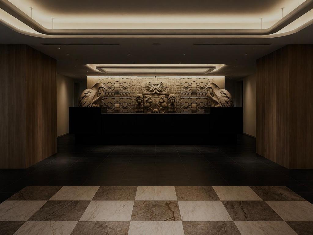 a room with a wall with a relief on it at Randor Hotel Sapporo Heritage in Sapporo