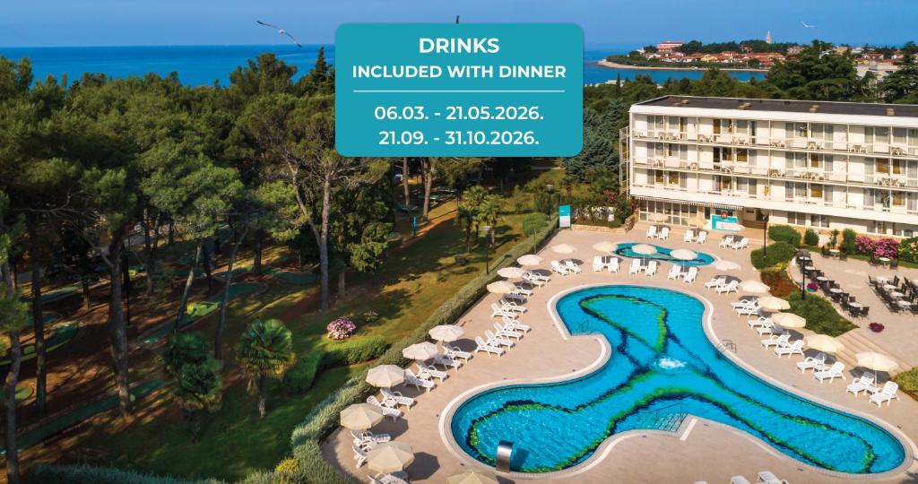 an aerial view of a resort with a swimming pool at Laguna Maradiso Hotel by Aminess in Novigrad Istria