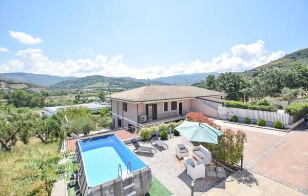 a house with a swimming pool in front of a house at Oltremare - casa vacanze Agropoli appartamento rooms in Agropoli