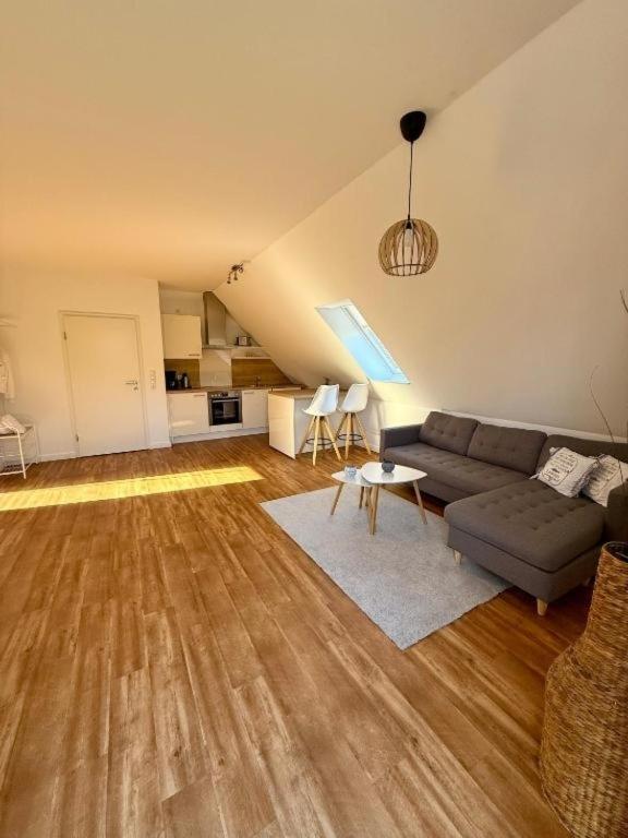a living room with a couch and a table at Inselhus in Burg auf Fehmarn