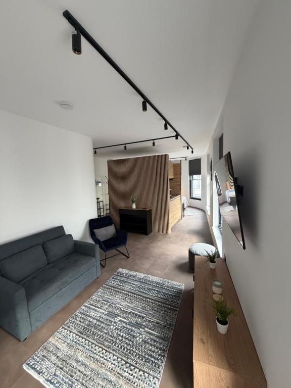 a living room with a couch and a table at 70 Bath Street in Saint Helier Jersey