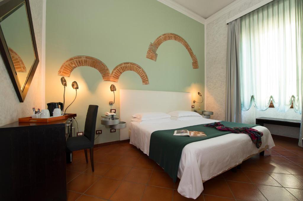 Posteľ alebo postele v izbe v ubytovaní Hotel De La Pace, Sure Hotel Collection by Best Western