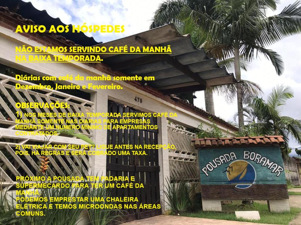 a sign for a cafe da manma in front of a building at Pousada Boramar in Boracéia